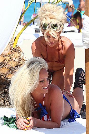 Danielle Mason in bikini and topless at the beach in Ibiza - July 08, 2014
