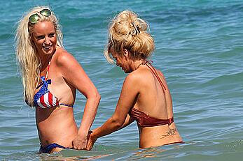 Danielle Mason in bikini and topless at the beach in Ibiza - July 08, 2014