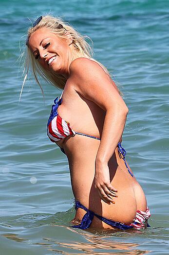 Danielle Mason in bikini and topless at the beach in Ibiza - July 08, 2014