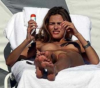 Edita Vilkeviciute caught topless on a beach