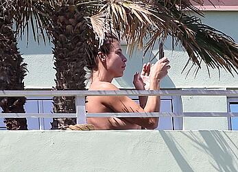 Elisabetta Canalis topless at on a balkony in Miami