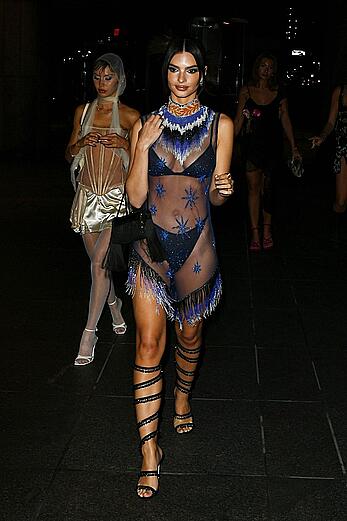 Emily Ratajkowski in a sheer ensemble attends the Met Gala After Party with friends