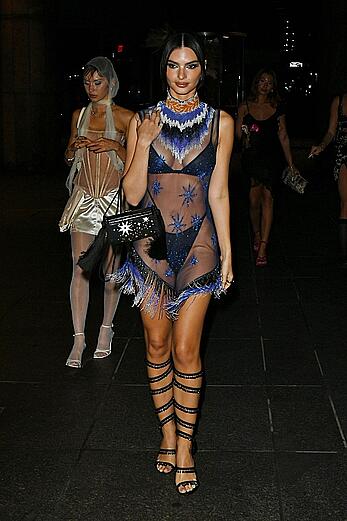 Emily Ratajkowski in a sheer ensemble attends the Met Gala After Party with friends