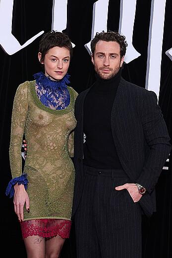 Emma Corrin brales in see through dress at Nosferatu World premiere in Berlin