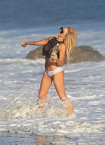 Francesca Larrain nude breasts under see through top in a new photoshoot for 138 Water on the beach