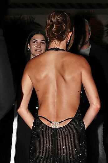 Hailey Bieber braless in sheer black dress at GQ Men of the Year party