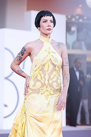 Halsey braless in yellow see through dress at The Smashing Machine red carpet in Venice