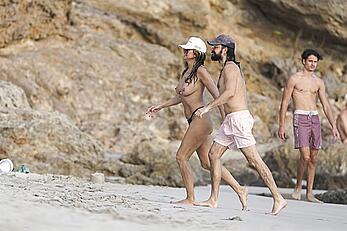 Heidi Klum in bikini and topless on the beach in St. Barths - December 12, 2025