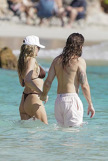 Heidi Klum in bikini and topless on the beach in St. Barths - December 12, 2025