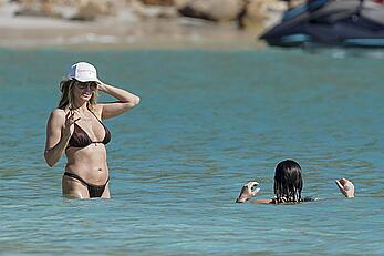 Heidi Klum in bikini and topless on the beach in St. Barths - December 12, 2025
