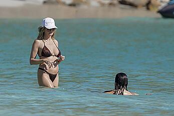 Heidi Klum in bikini and topless on the beach in St. Barths - December 12, 2025