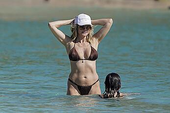 Heidi Klum in bikini and topless on the beach in St. Barths - December 12, 2025