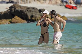 Heidi Klum in bikini and topless on the beach in St. Barths - December 12, 2025