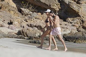 Heidi Klum in bikini and topless on the beach in St. Barths - December 12, 2025