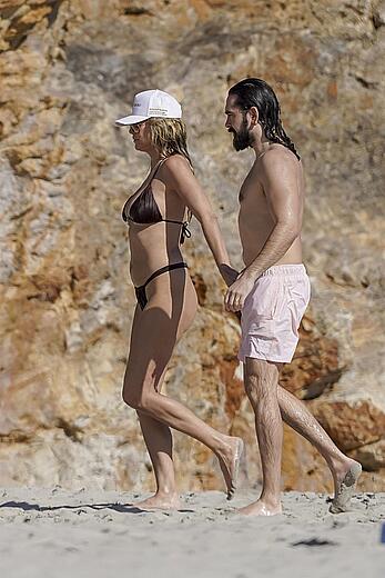 Heidi Klum in bikini and topless on the beach in St. Barths - December 12, 2025