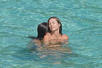Heidi Klum topless at beach Getaway in St. Barts