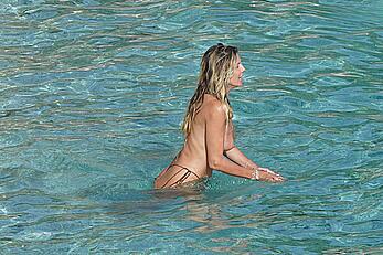 Heidi Klum topless at beach Getaway in St. Barts