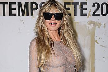 Heidi Klum braless in a sheer dress at Vetements Womenswear Spring∕Summer 2026 show in Paris