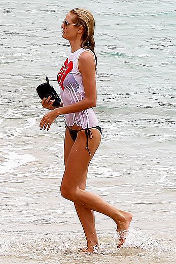 Heidi Klum in wet shirt on the beach in St.Barths