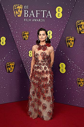Jenna Coleman braless in sheer dress at 2026 EE BAFTA Film Awards in London