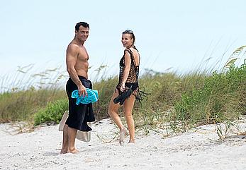 Joanna Krupa topless and in black bikini at the beach in Miami