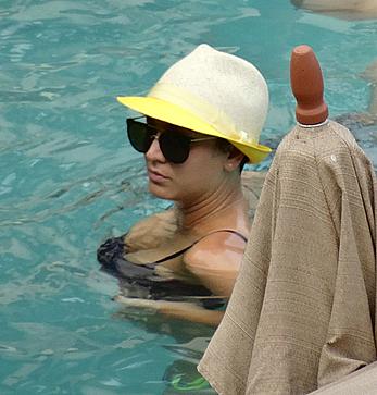 Kaley Cuoco wearing a bikini at a pool in Mexico