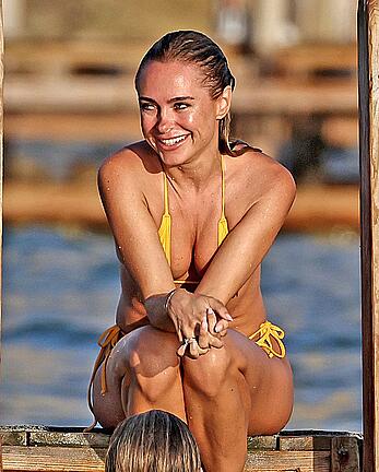 Kimberley Garner in yellow bikini enjoys a sunny beach day in Ibiza - August 18, 2026