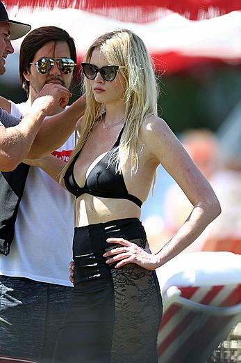 Lara Stone seen topless during a swimwear photoset on Miami Beach
