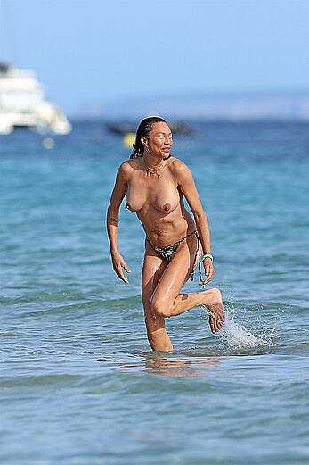Lilly Becker goes topless at the beach during a sunshine break in Ibiza with friends