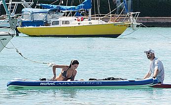 Lucy Mecklenburgh paddleboarding in black bikini in Miami