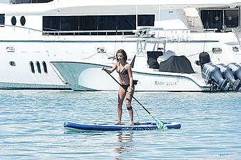 Lucy Mecklenburgh paddleboarding in black bikini in Miami