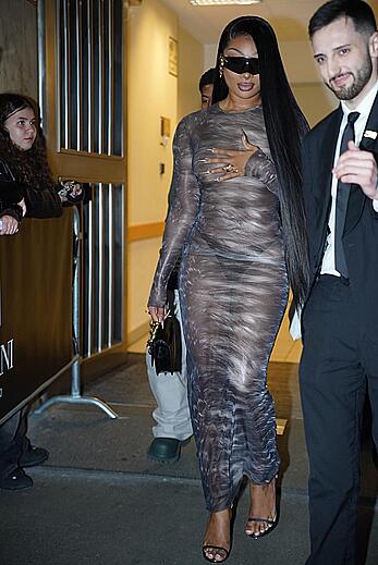 Megan Thee Stallion braless in sheer dress before the runway of Roberto Cavalli show in Milan