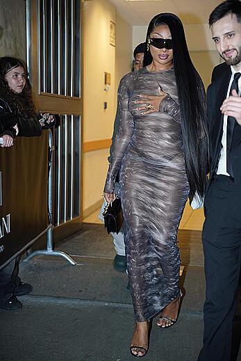 Megan Thee Stallion braless in sheer dress before the runway of Roberto Cavalli show in Milan