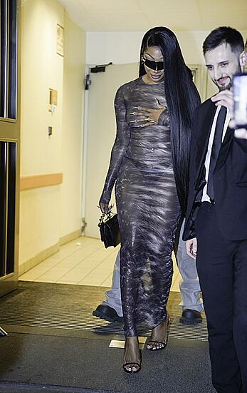 Megan Thee Stallion braless in sheer dress before the runway of Roberto Cavalli show in Milan