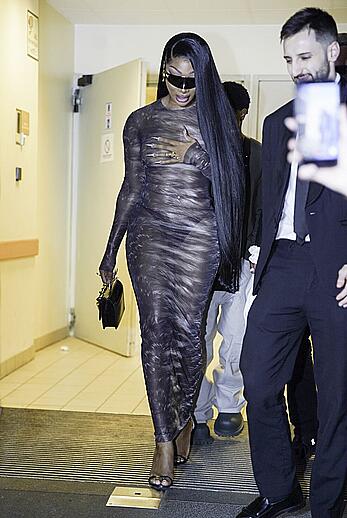 Megan Thee Stallion braless in sheer dress before the runway of Roberto Cavalli show in Milan