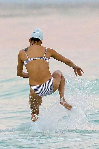 Michelle Rodriguez nipple slip on a beach in Mexico