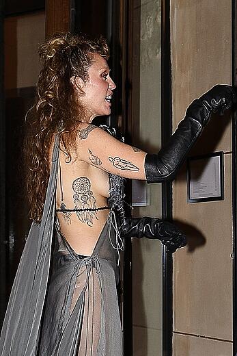 Miley Cyrus in a sheer dress in Paris