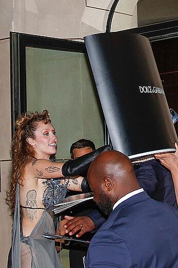 Miley Cyrus in a sheer dress in Paris