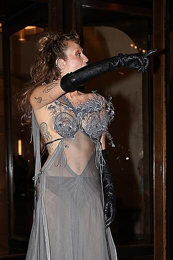 Miley Cyrus in a sheer dress in Paris