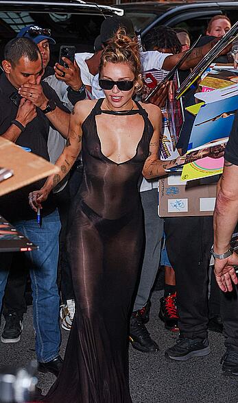 Miley Cyrus in see through dress with no bra arrives back to her hotel