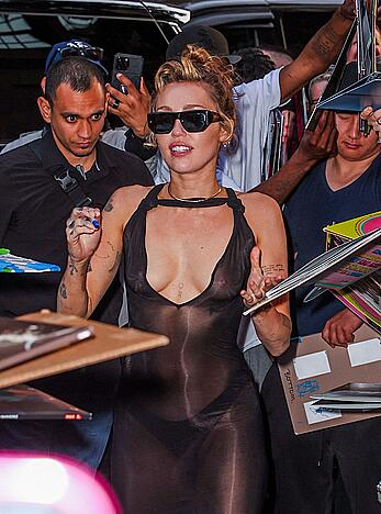 Miley Cyrus in see through dress with no bra arrives back to her hotel