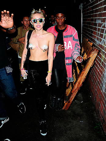 Miley Cyrus almost topless with pasties arriving to Alexander Wang after party