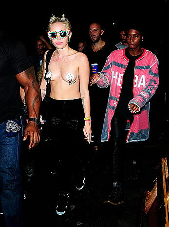 Miley Cyrus almost topless with pasties arriving to Alexander Wang after party