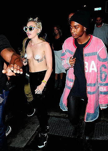 Miley Cyrus almost topless with pasties arriving to Alexander Wang after party