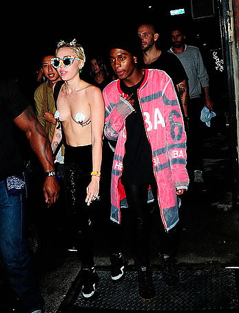 Miley Cyrus almost topless with pasties arriving to Alexander Wang after party