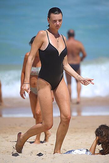 Montana Cox sunbathing topless on a beach in Sydney