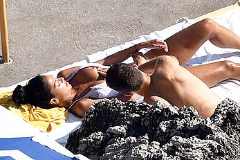 Nicole Scherzinger boobs out while sunbathing with boyfriend in Capri