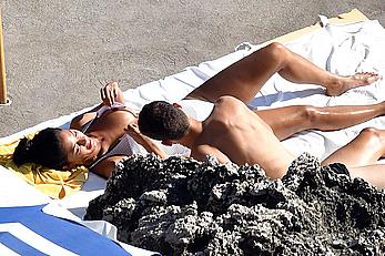 Nicole Scherzinger boobs out while sunbathing with boyfriend in Capri