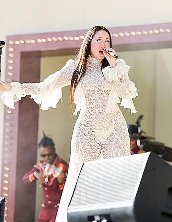 Noah Cyrus braless in see through dress performs at 2025 Coachella Valley Festival