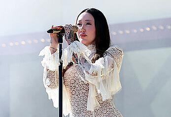 Noah Cyrus braless in see through dress performs at 2025 Coachella Valley Festival